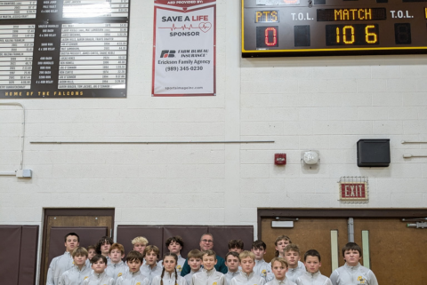 Group in front of banner