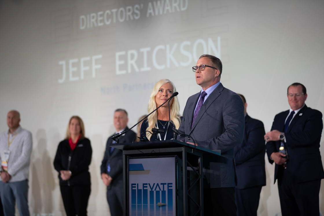 Jeff and Sandi standing at podium